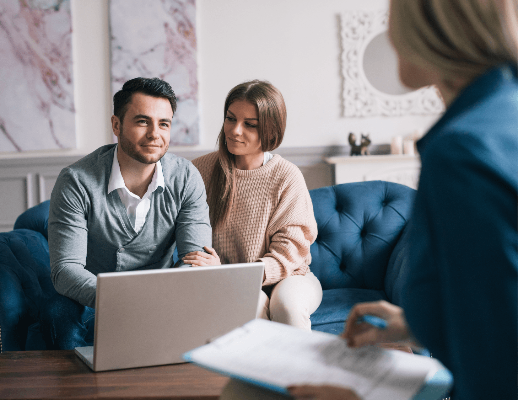 Drivers reviewing affordable auto insurance with an agent